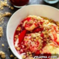 A tangy raspberry peach sauce gets draped over several scoops of creamy vanilla ice cream with a buttery oatmeal cookie streusel. This raspberry peach melba is summer in a bowl!