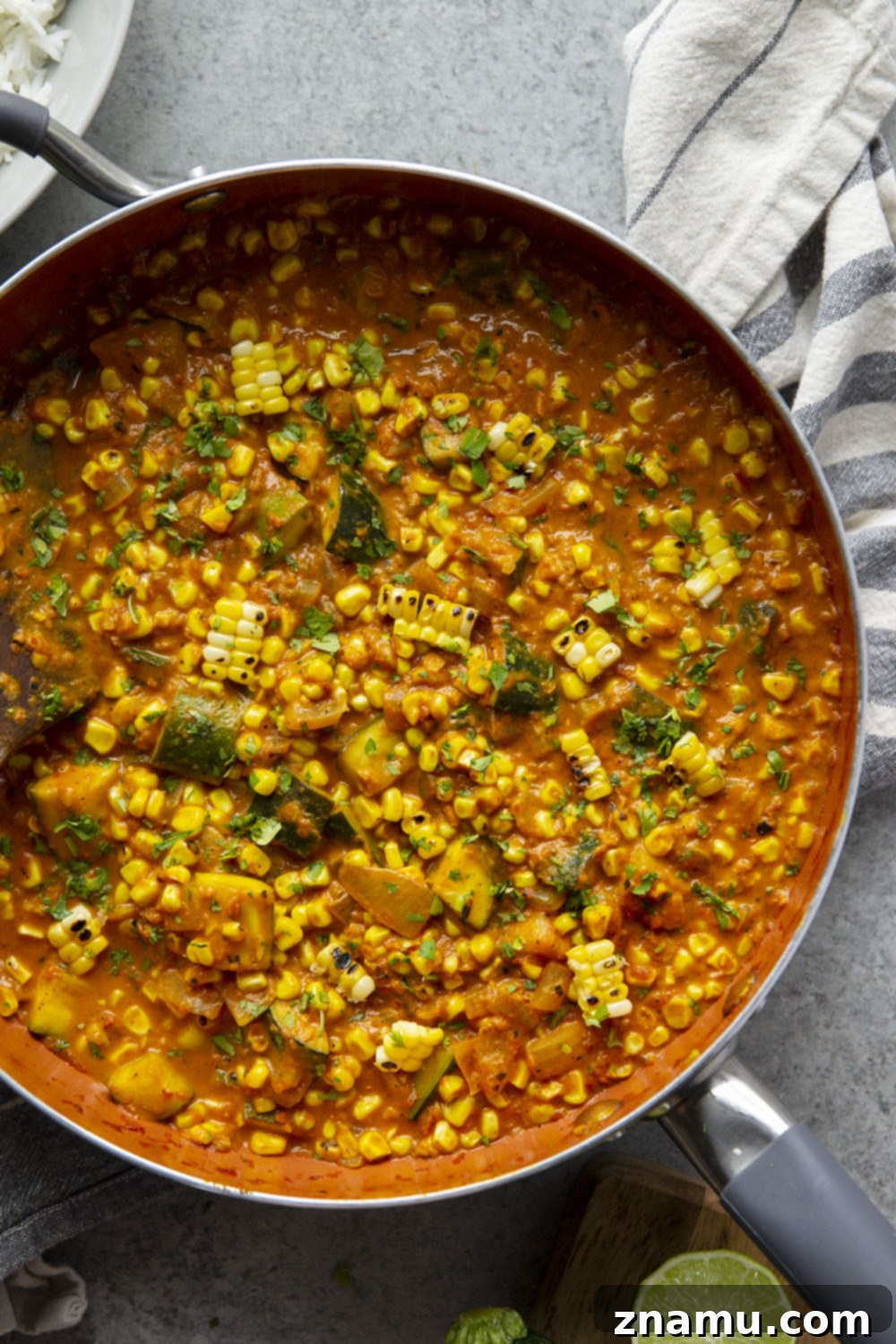 Smoky Sweet Corn Zucchini Curry 5 Charred sweet corn and tender zucchini simmers in a flavorful coconut curry sauce and is incredible served over fluffy rice. This sweet corn zucchini curry is a great way to use up summer vegetables!