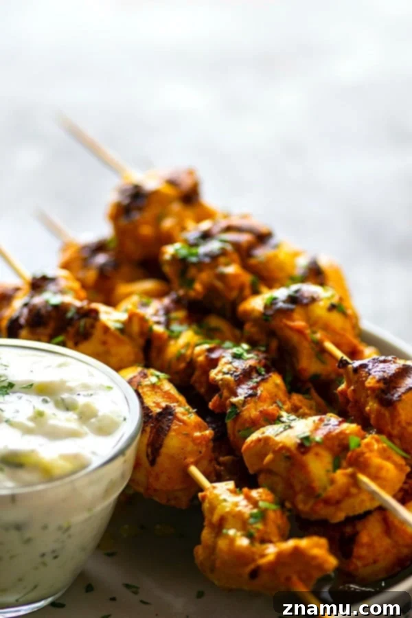 Ultimate Grilled Tandoori Chicken Skewers 3 Hands down the BEST grilled tandoori chicken skewers you will ever throw on the grill this summer. The secret is in the SUPER flavorful long marinade and homemade tzatziki sauce.