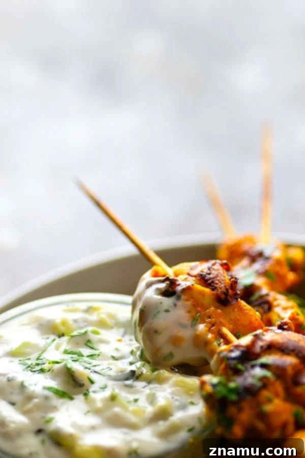 Ultimate Grilled Tandoori Chicken Skewers 4 Hands down the BEST grilled tandoori chicken skewers you will ever throw on the grill this summer. The secret is in the SUPER flavorful long marinade and homemade tzatziki sauce.