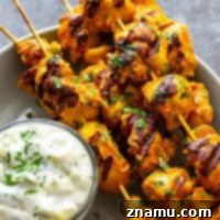 Ultimate Grilled Tandoori Chicken Skewers 7 Hands down the BEST grilled tandoori chicken skewers you will ever throw on the grill this summer. The secret is in the SUPER flavorful long marinade and homemade tzatziki sauce.
