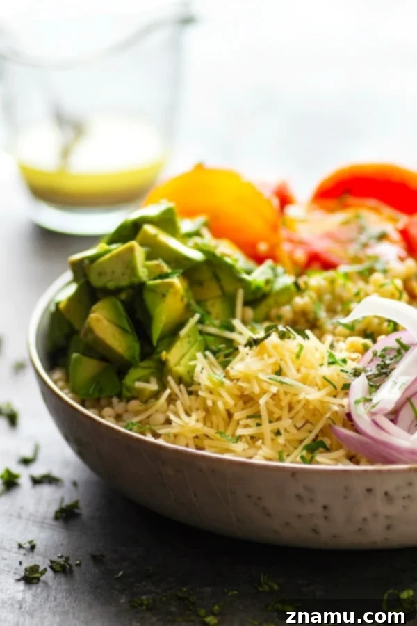 Vibrant Heirloom & Avocado Pearl Couscous 3 Juicy fresh heirloom tomatoes and silky avocado bring incredible summer flavors to this colorful Israeli couscous salad that's easy to throw together and a STUNNER for any summer table!