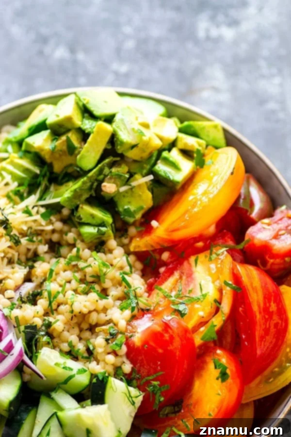Vibrant Heirloom & Avocado Pearl Couscous 4 Juicy fresh heirloom tomatoes and silky avocado bring incredible summer flavors to this colorful Israeli couscous salad that's easy to throw together and a STUNNER for any summer table!