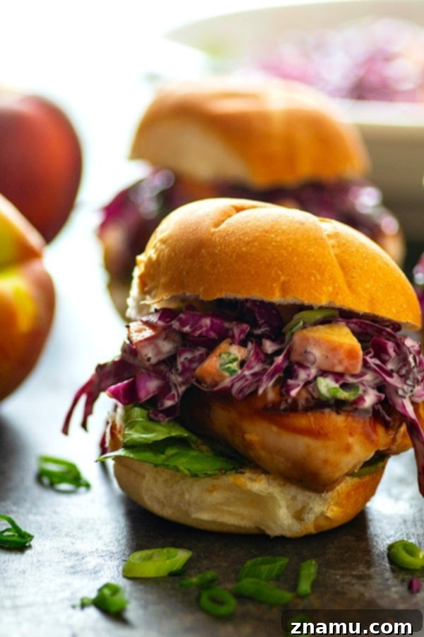 Peach Scallion Slaw BBQ Chicken Sliders 3 Stacked Barbecue Chicken Sliders with a generous helping of Peach Scallion Slaw – a hearty and satisfying summer finger food