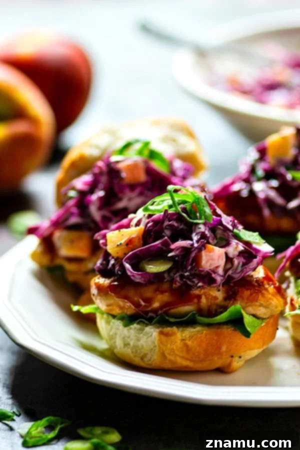 Peach Scallion Slaw BBQ Chicken Sliders 4 Close-up of a Barbecue Chicken Slider with Peach Scallion Slaw, showcasing the delicious layers