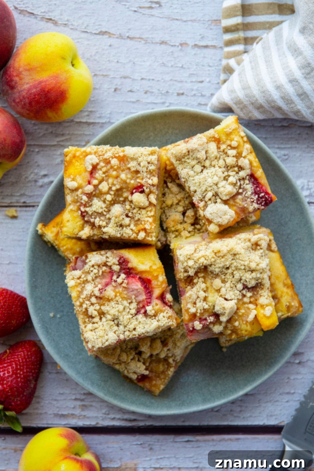 Summer Strawberry Peach Bake 2 Fresh strawberries and peaches join forces in this streusel covered strawberry peach buckle that's a perfect summer coffee cake or dessert!