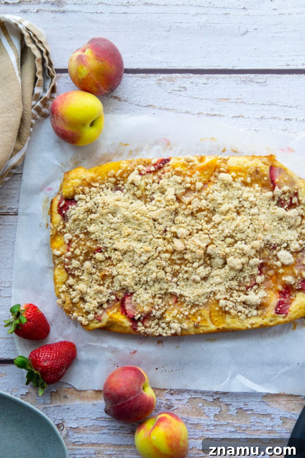Summer Strawberry Peach Bake 3 Fresh strawberries and peaches join forces in this streusel covered strawberry peach buckle that's a perfect summer coffee cake or dessert!