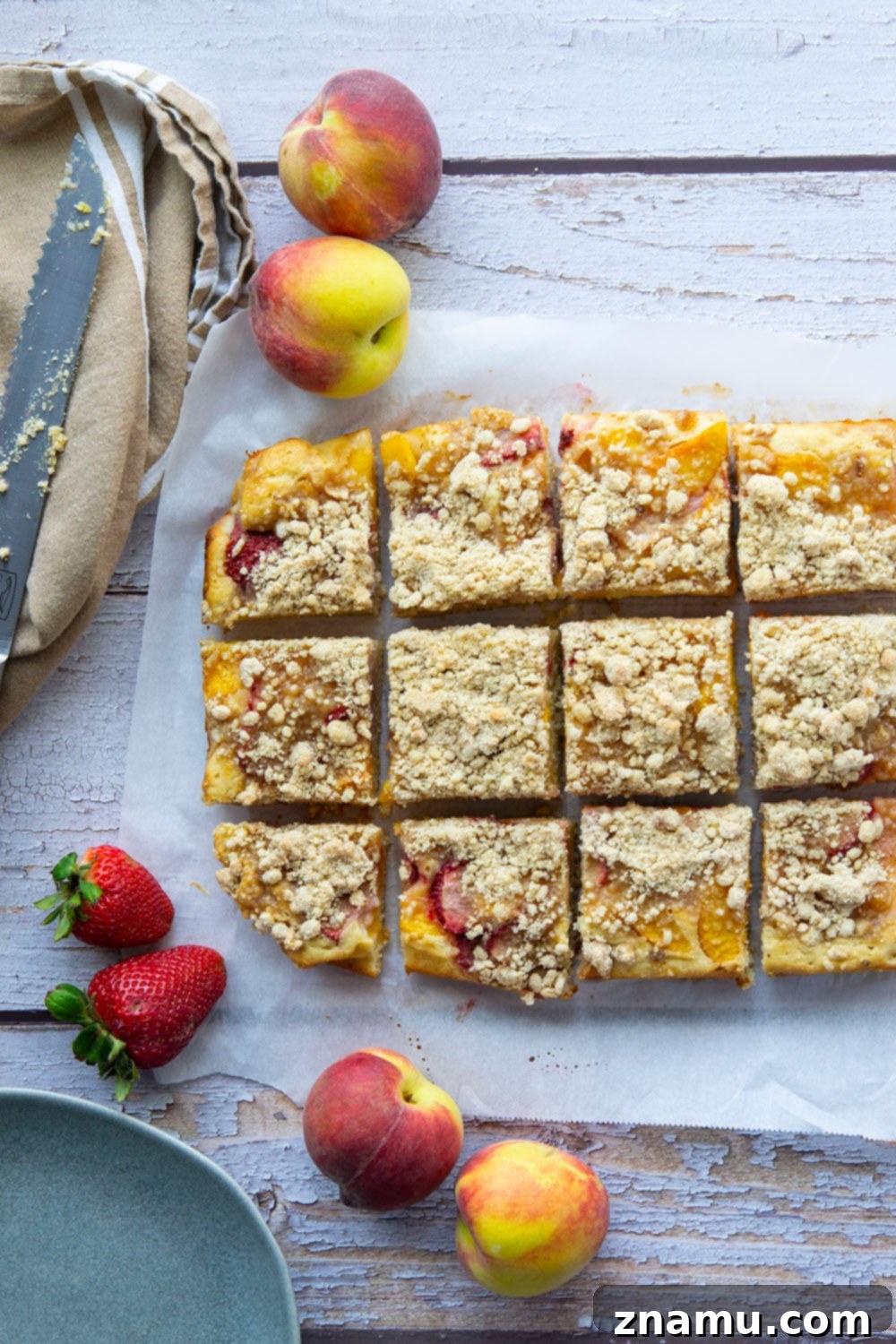 Summer Strawberry Peach Bake 4 Fresh strawberries and peaches join forces in this streusel covered strawberry peach buckle that's a perfect summer coffee cake or dessert!
