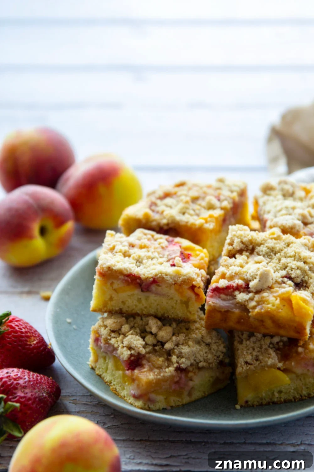 Summer Strawberry Peach Bake 5 Fresh strawberries and peaches join forces in this streusel covered strawberry peach buckle that's a perfect summer coffee cake or dessert!