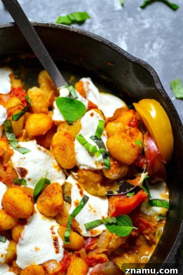 Juicy roasted heirloom tomatoes and creamy fresh mozzarella make the most amazing flavor duo in this summery mozzarella gnocchi skillet that you'll have on the table in MINUTES!