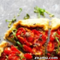 Ricotta Basil Pesto Cherry Tomato Tart 7 Ricotta Basil Pesto Cherry Tomato Galette - Creamy ricotta and flavorful basil pesto compliment sweet summer-fresh cherry tomatoes incredibly in this beautiful summertime cherry tomato galette!
