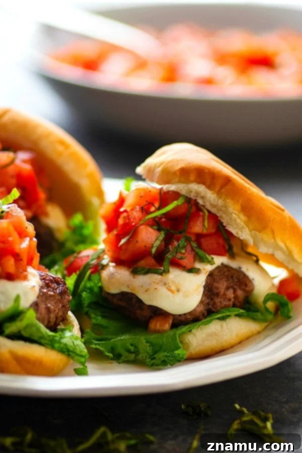 Bruschetta Caprese Burgers 4 Basil Bruschetta Mozzarella Burgers - Juicy, melty mozzarella burgers are piled high with a flavorful basil bruschetta topping for the BEST summer burger any cookout could ask for!