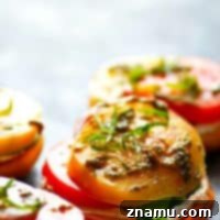 Open-Faced Heirloom Tomato Goat Cheese Bagel Sandwiches - Creamy goat cheese and ULTRA-juicy heirloom tomatoes join forces and take these summery open-faced goat cheese bagel sandwiches to the next level!