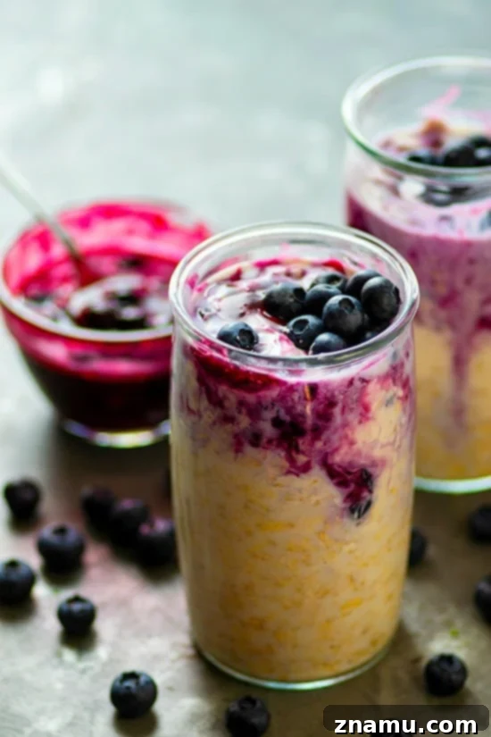 Overnight oats with blueberry pie filling and cheesecake swirl in a mason jar