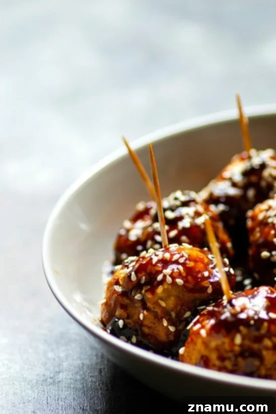 Instant Pot Sticky Honey Sesame Chicken Meatballs 2 Instant Pot Honey Sesame Glazed Chicken Meatballs - Super tender chicken meatballs smothered in a sweet 'n' savory honey sesame sauce, made effortlessly in the Instant Pot. Perfect for appetizers or a quick dinner!