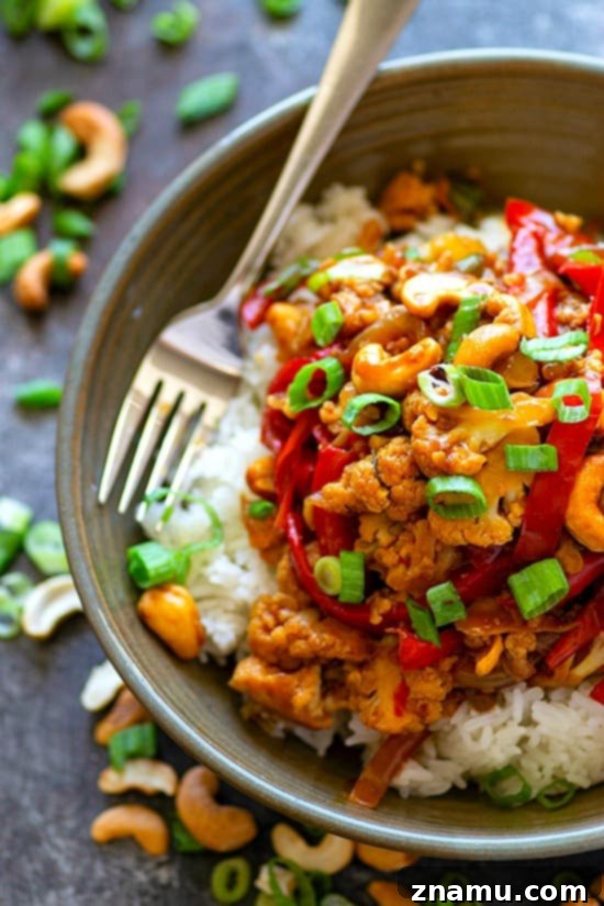 Delicious Miso Sweet Pepper Cashew Cauliflower Stir-Fry in a wok, ready to be served