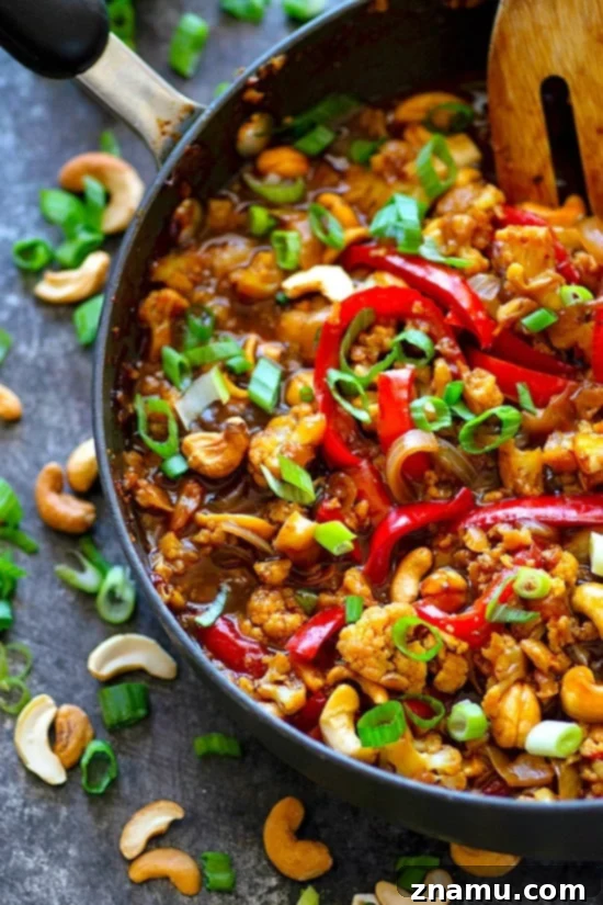 A beautifully plated Miso Sweet Pepper Cashew Cauliflower Stir-Fry, showcasing its vibrant colors and inviting texture