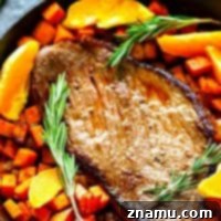 One-Pan Orange Rosemary Steak and Sweet Potatoes - Juicy oranges and fragrant rosemary join forces in this weeknight-friendly one-pan orange rosemary steak roasted with tender sweet potatoes in an incredible orange rosemary sauce!