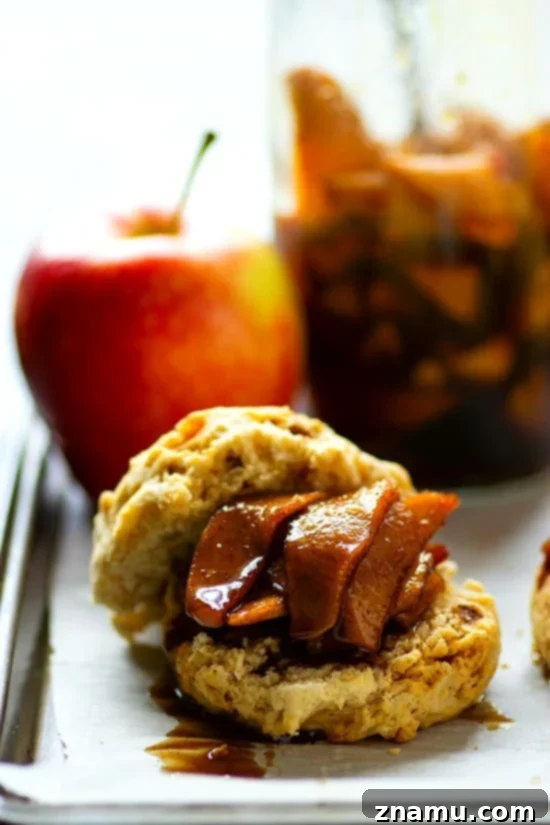 Nutty Brown Butter Biscuits with Apple Preserves 5 A close-up of a halved browned butter biscuit, generously filled with homemade apple preserves.
