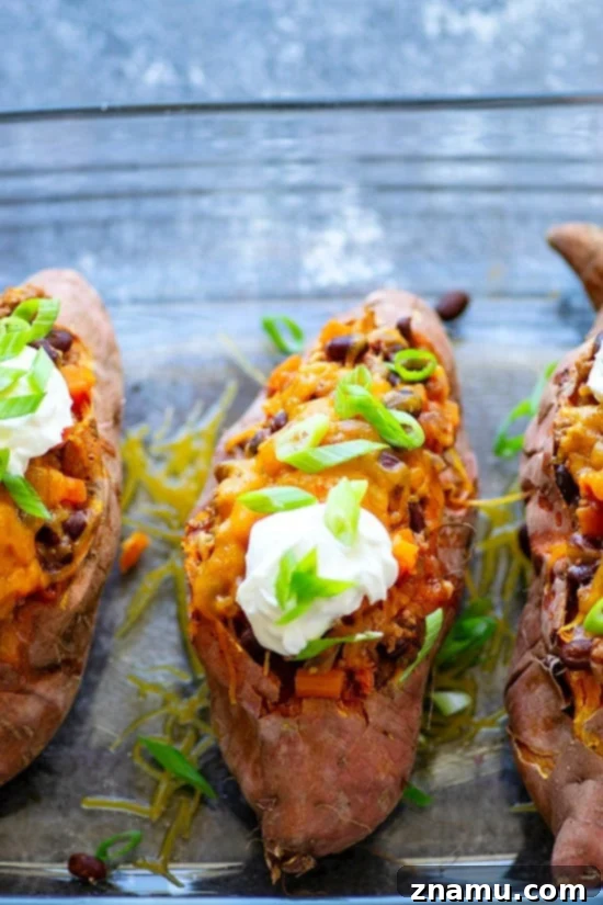 Loaded Turkey Chili Sweet Potato Boats 4 A family-friendly meal idea: Turkey Chili Twice-Baked Sweet Potatoes prepared in a baking dish, ready to be served.