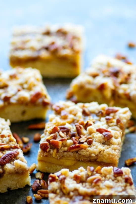 Maple Pecan Apple Crumble Cake 4 Maple Pecan Apple Buckle - Three layers of soft maple cake, tender sauteed apples, and buttery crumb topping collide in this indulgent maple pecan apple buckle that's perfect for ANY fall occasion!