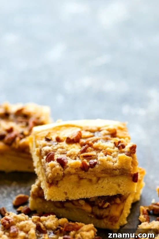 Maple Pecan Apple Crumble Cake 5 Maple Pecan Apple Buckle - Three layers of soft maple cake, tender sauteed apples, and buttery crumb topping collide in this indulgent maple pecan apple buckle that's perfect for ANY fall occasion!