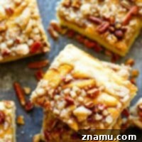 Maple Pecan Apple Crumble Cake 7 Maple Pecan Apple Buckle - Three layers of soft maple cake, tender sauteed apples, and buttery crumb topping collide in this indulgent maple pecan apple buckle that's perfect for ANY fall occasion!