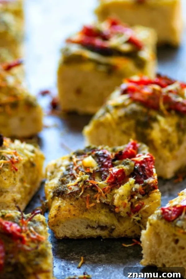 Deliciously soft Roasted Garlic Sun-Dried Tomato Pesto Focaccia with vibrant toppings