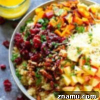 Cranberry Apple Delicata Squash Quinoa Salad - Loaded with tangy cranberries and crunchy apples, this delicata squash quinoa salad is the perfect winter side salad for any gathering and doubles as fantastic lunch leftovers!