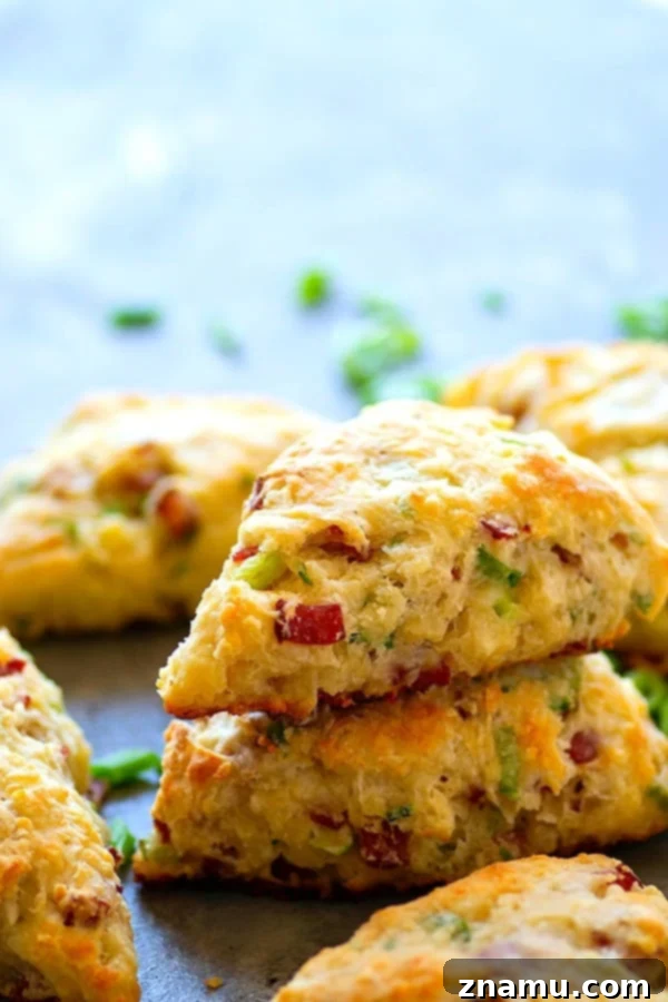 Savory White Cheddar Bacon Scallion Scones 2 Fluffy White Cheddar Bacon Scallion Scones ready for baking, showcasing the perfect blend of ingredients.