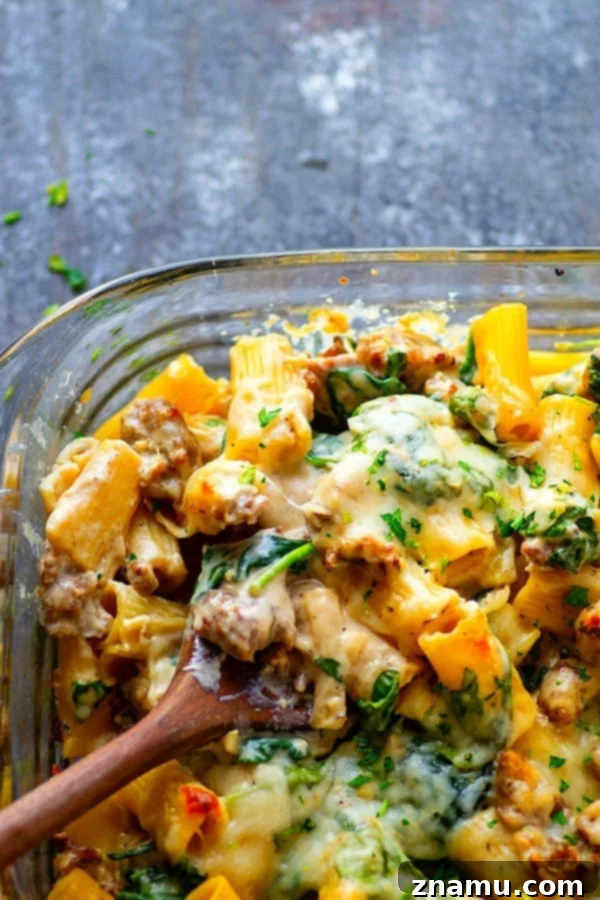 Creamy Alfredo Sausage and Spinach Ziti Bake 4 Layered baked ziti with cheese pull