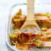 Alfredo Green Chile Chicken Enchiladas - Spicy green chile pulled chicken and a creamy white alfredo sauce are a DREAMY combo in these cozy, cheesy green chile chicken enchiladas! Use leftover chicken for MAXIMUM ease.