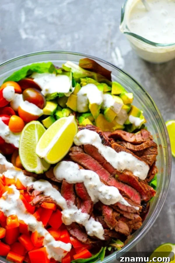 Hearty Carne Asada Bowls with Bold Bleu Cheese 2 Carne Asada Steak Salad Bowls featuring perfectly marinated flank steak, fresh greens, cherry tomatoes, avocado, and sweet peppers, drizzled with creamy bleu cheese dressing.