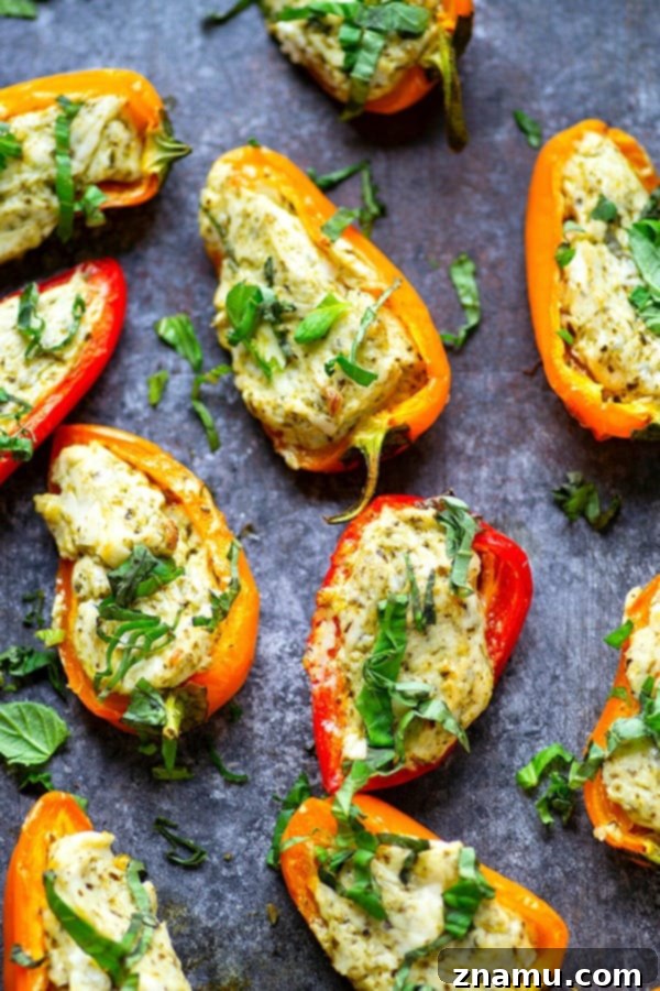 Mini Pesto Sweet Pepper Poppers 3 Pesto Stuffed Sweet Pepper Poppers - Stuffed with a super flavorful creamy pesto filling, these pesto stuffed sweet pepper poppers are SUPER addicting and the perfect little party app!