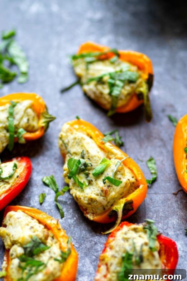 Mini Pesto Sweet Pepper Poppers 4 Pesto Stuffed Sweet Pepper Poppers - Stuffed with a super flavorful creamy pesto filling, these pesto stuffed sweet pepper poppers are SUPER addicting and the perfect little party app!
