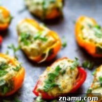 Mini Pesto Sweet Pepper Poppers 7 Pesto Stuffed Sweet Pepper Poppers - Stuffed with a super flavorful creamy pesto filling, these pesto stuffed sweet pepper poppers are SUPER addicting and the perfect little party app!