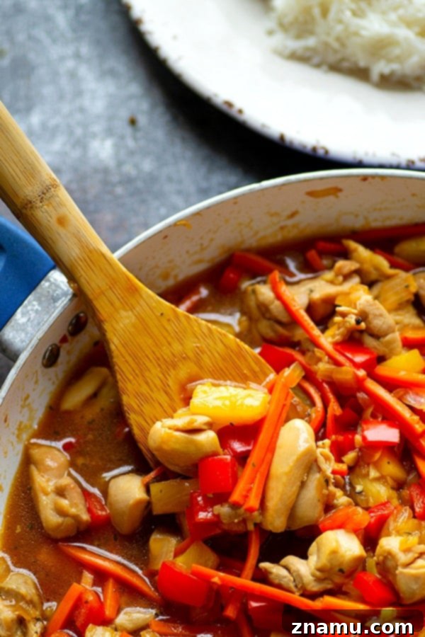 Aloha Teriyaki Chicken Skillet 3 Close-up of Hawaiian Chicken Teriyaki Stir-Fry in a pan, showcasing the rich sauce and fresh ingredients.