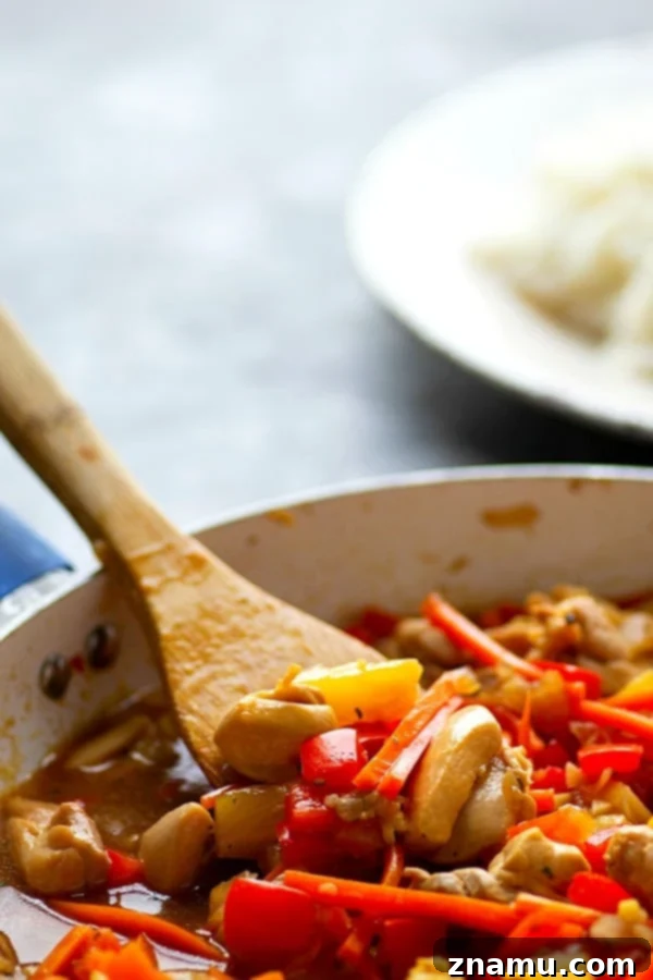 Aloha Teriyaki Chicken Skillet 5 Close-up of golden brown chicken and stir-fried vegetables with teriyaki sauce.