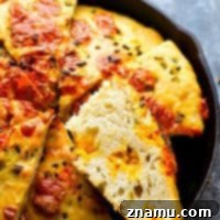 Jalapeno Cheddar Focaccia - Gooey pockets of sharp cheddar cheese and spicy jalapeno bits are the most INSANE duo in this incredibly soft and flavorful jalapeno cheddar focaccia bread!