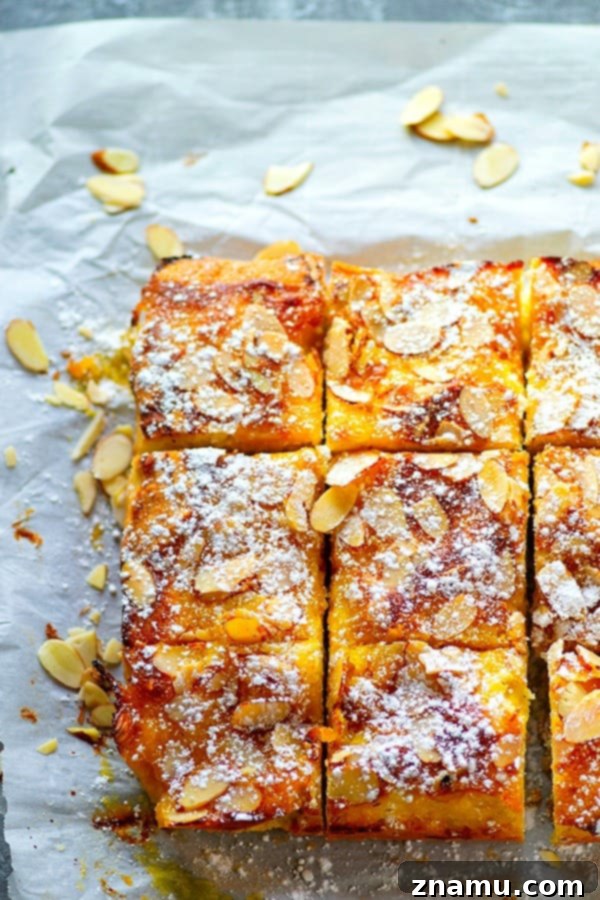 Lemon Curd Almond Butter Cake 5 A piece of Lemon Curd Almond Butter Cake, rich and moist, showcasing the texture and the inviting blend of lemon and almond flavors.