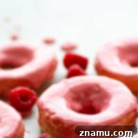 Zesty Lemon Sour Cream Doughnuts with Raspberry Glaze 7 Raspberry-Glazed Lemon Sour Cream Donuts - Soft, tangy lemon sour cream donuts are glazed in a sweet raspberry glaze and a much healthier way to get your donut fix!