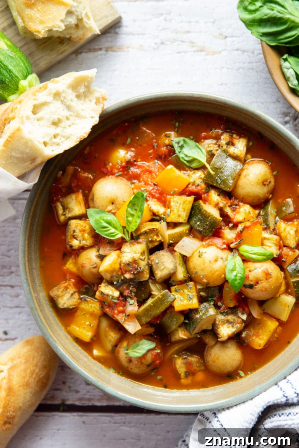 Ciambotta The Italian Ratatouille 6 A generous serving of fresh Italian Ratatouille (Ciambotta) with bread for dipping.