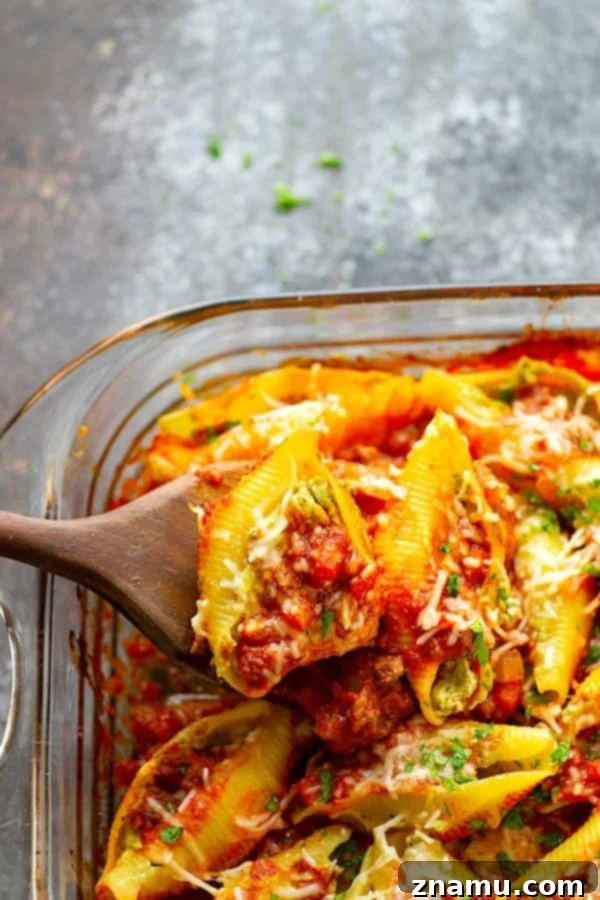 Decadent Pesto Cream Cheese Stuffed Shells Bolognese 2 Pesto Cream Cheese Stuffed Shells Bolognese - Stuffed with a rich pesto cream cheese and baked in a flavorful homemade bolognese sauce, this cream cheese stuffed shells bolognese tastes like authentic Italian food, only made SUPER fast and easy!
