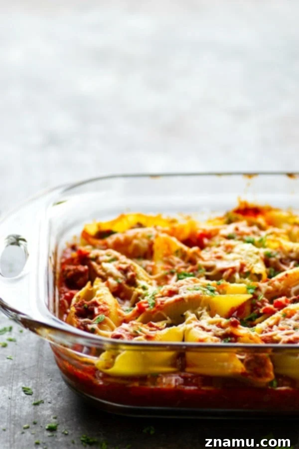 Decadent Pesto Cream Cheese Stuffed Shells Bolognese 3 Pesto Cream Cheese Stuffed Shells Bolognese - Stuffed with a rich pesto cream cheese and baked in a flavorful homemade bolognese sauce, this cream cheese stuffed shells bolognese tastes like authentic Italian food, only made SUPER fast and easy!