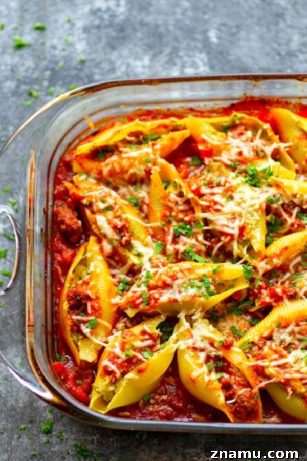 Decadent Pesto Cream Cheese Stuffed Shells Bolognese 4 Pesto Cream Cheese Stuffed Shells Bolognese - Stuffed with a rich pesto cream cheese and baked in a flavorful homemade bolognese sauce, this cream cheese stuffed shells bolognese tastes like authentic Italian food, only made SUPER fast and easy!