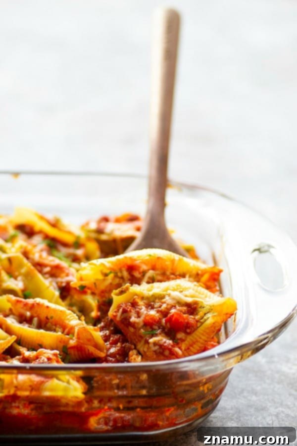Decadent Pesto Cream Cheese Stuffed Shells Bolognese 5 Pesto Cream Cheese Stuffed Shells Bolognese - Stuffed with a rich pesto cream cheese and baked in a flavorful homemade bolognese sauce, this cream cheese stuffed shells bolognese tastes like authentic Italian food, only made SUPER fast and easy!