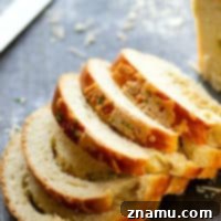 Roasted Garlic Asiago Swirl Bread - Flavorful roasted garlic and sharp Asiago cheese are swirled into this incredibly soft and tender yeast bread.