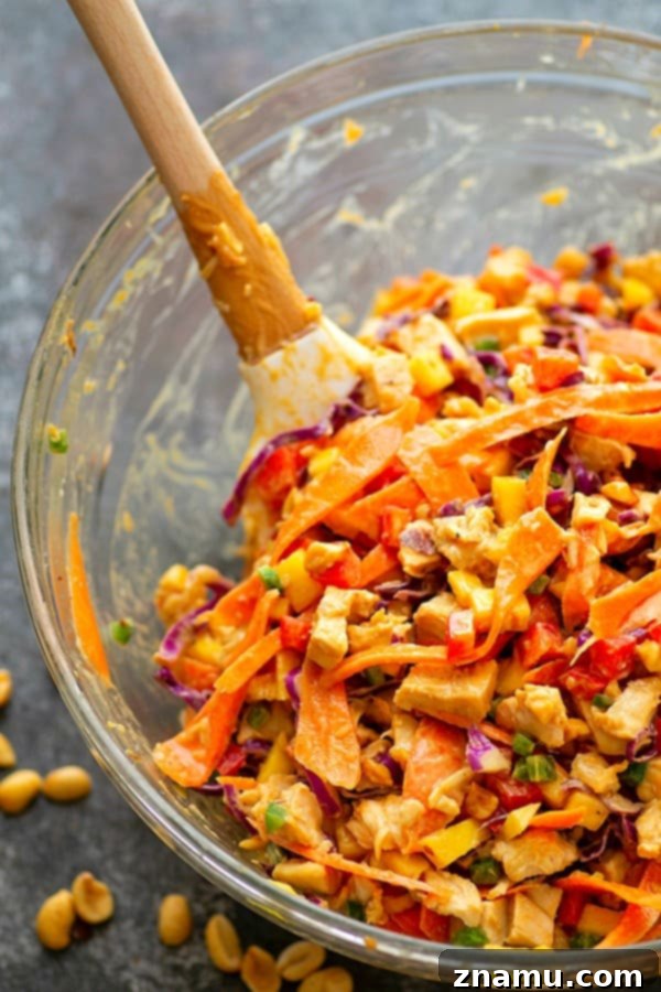 Sweet Heat Thai Mango Peanut Chicken Lettuce Wraps 3 Spicy Peanut Thai Mango Chicken Lettuce Wraps - A creamy peanut sauce and spicy Thai flavors collide in these colorful mango chicken lettuce wraps that are a perfect lighter lunch or dinner!