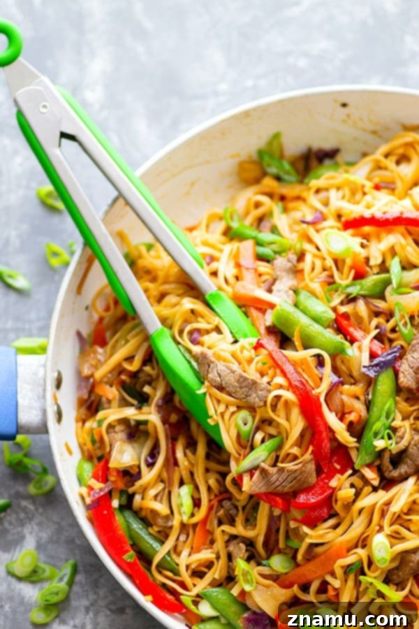 Garlic Sweet Pepper Steak Lo Mein - Juicy steak strips, a rainbow of fresh veggies, and tender lo mein noodles collide in this weeknight-friendly steak lo mein.