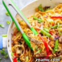 Garlic Sweet Pepper Steak Lo Mein - Juicy steak strips, a rainbow of fresh veggies, and tender lo mein noodles collide in this weeknight-friendly steak lo mein.